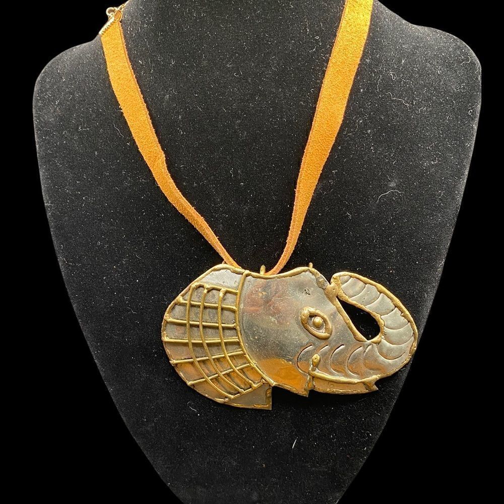 Elephant pendant/brooch combination silver tone with brass trim on brown choker